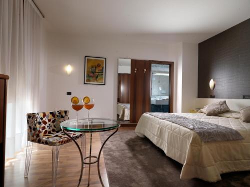Postel nebo postele na pokoji v ubytování Hotel Al Pino Verde