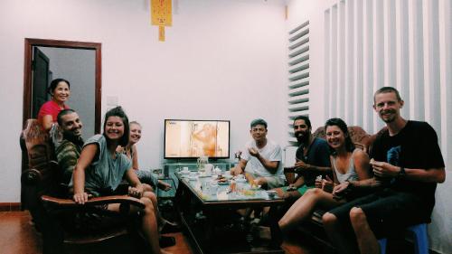 a group of people sitting around a table at Vietnam Phuot Real Home in Kon Tum
