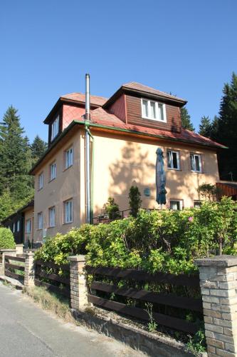 a large house with a fence in front of it at Chata Javorina in Javorník