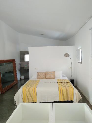 Postel nebo postele na pokoji v ubytování La Maga Rooms
