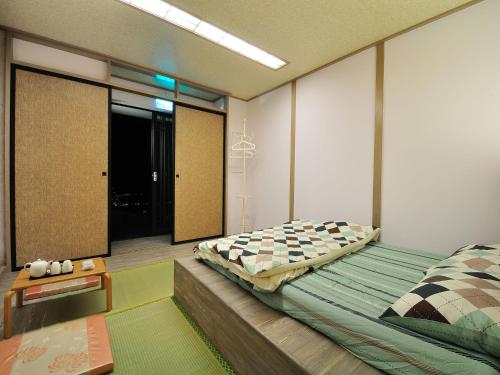 Posteľ alebo postele v izbe v ubytovaní Sunnyrain Hostel