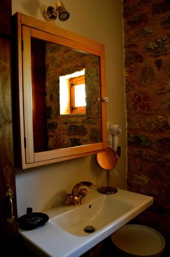 a bathroom with a sink and a mirror at Messana in Messini
