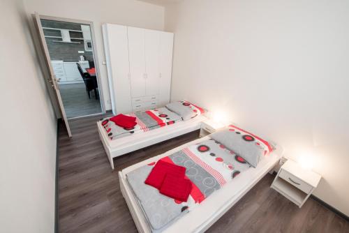 Ένα ή περισσότερα κρεβάτια σε δωμάτιο στο Apartmany 154