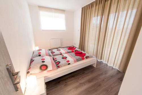 Ένα ή περισσότερα κρεβάτια σε δωμάτιο στο Apartmany 154