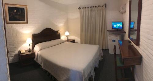 Giường trong phòng chung tại Hotel Camelot