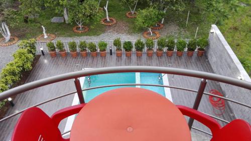 an overhead view of a swimming pool on a balcony at Gold Guest House in Gonio