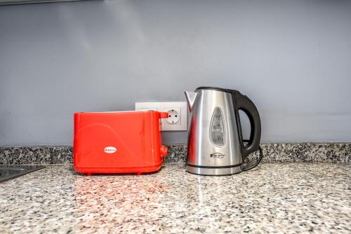 a toaster and a toaster sitting on a counter at Veramar Aparthotel in Fuengirola