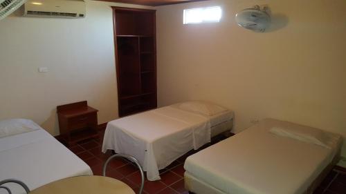 Ein Bett oder Betten in einem Zimmer der Unterkunft Hotel Sandiego inc