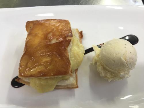 a piece of pie and a scoop of ice cream on a plate at Zezilionea in Olaberría