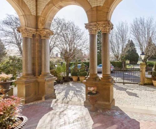 an archway of a building with a courtyard at The Chapel Boutique Bed and Breakfast in Harrogate