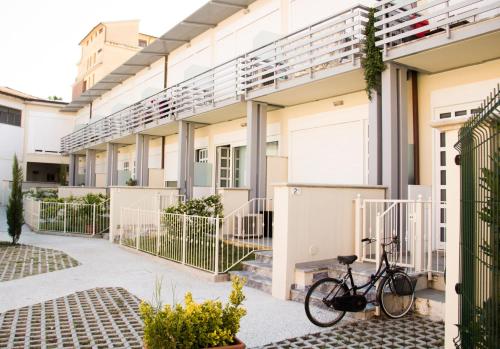 a bike parked in front of a building at InnPisaRentals - Loft in Pisa Historical Center in Pisa