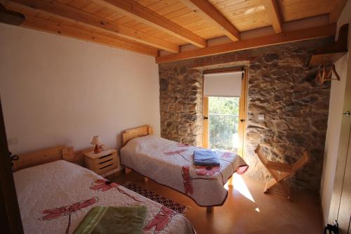 Кровать или кровати в номере Horta do Zé Miguel