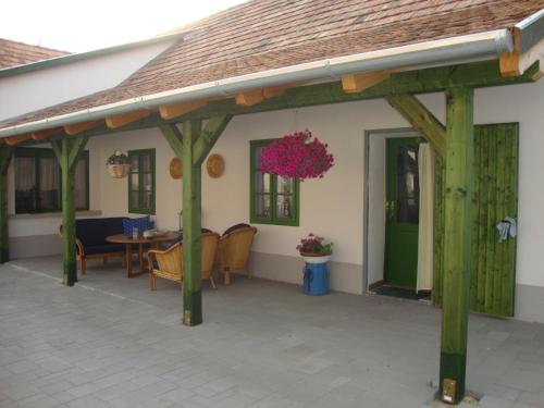 a pavilion with a table and chairs on a patio at Ferienhaus Somloi Sellö in Somlószőlős