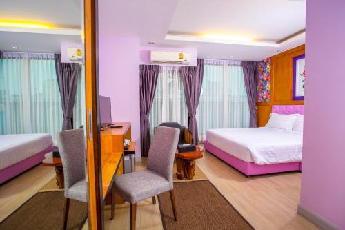 Postel nebo postele na pokoji v ubytování Triple B Boutique Residence