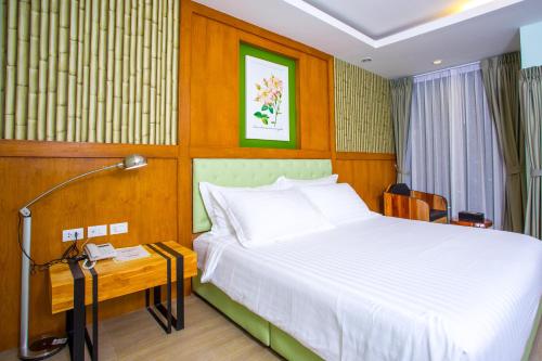 Postel nebo postele na pokoji v ubytování Triple B Boutique Residence