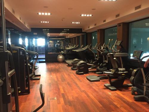 a gym with a bunch of treadmills at Hotel Gołębiewski Białystok in Białystok