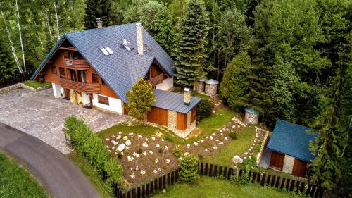 an aerial view of a house in the woods at Apartmány Slunce in Harrachov