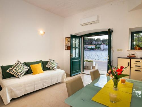 a living room with a couch and a table at Apartment Lejla in Povlja