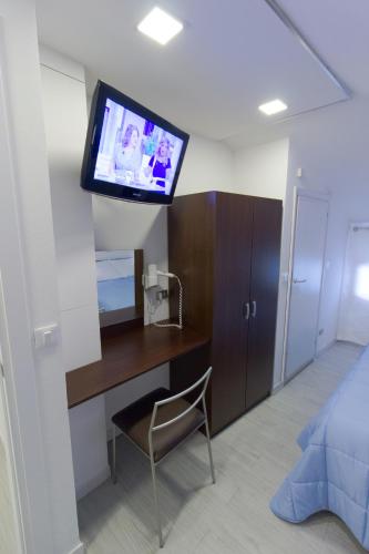 TV a/nebo společenská místnost v ubytování Albergo Romagna