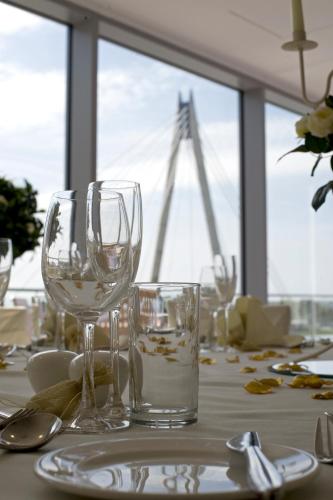 a table with two wine glasses on top of it at Waterfront Southport Hotel in Southport