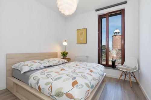 Llit o llits en una habitació de Jantar Apartamenty Design Latarnia Morska