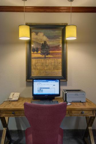 a desk with a laptop computer and a printer at Baymont by Wyndham Golden/Red Rocks in Lakewood