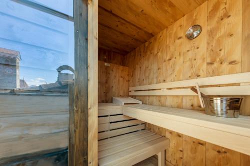 a sauna with a view of the water at Hotel Schlosswirt in Schenna