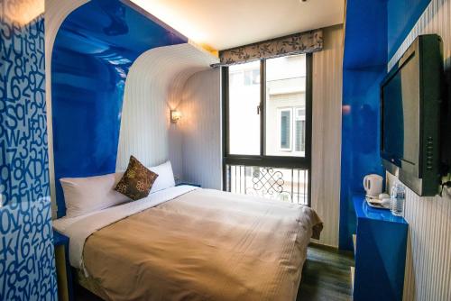 Кровать или кровати в номере Lio Hotel - Ximending