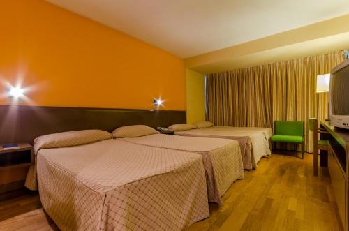 Кровать или кровати в номере Hotel Sant Eloi