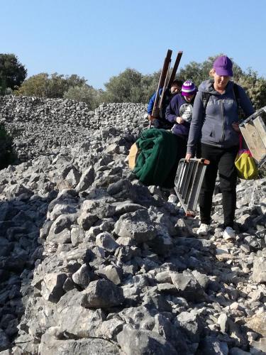 a group of people standing on a rocky mountain at B&B Marijana in Malinska
