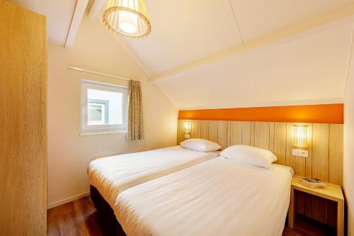Center Parcs Les Ardennesにあるベッド