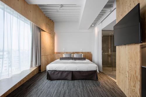 Una cama o camas en una habitación de ONE@Tokyo
