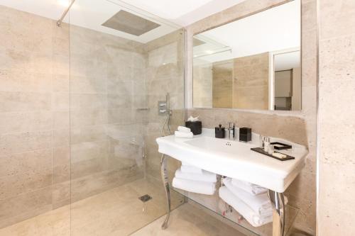 a bathroom with a sink and a shower at Palais Saleya Boutique hôtel in Nice