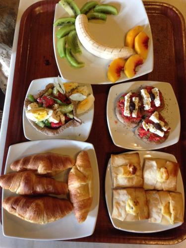 a tray filled with different types of breakfast foods at Samonas Traditional Villas in Samonás