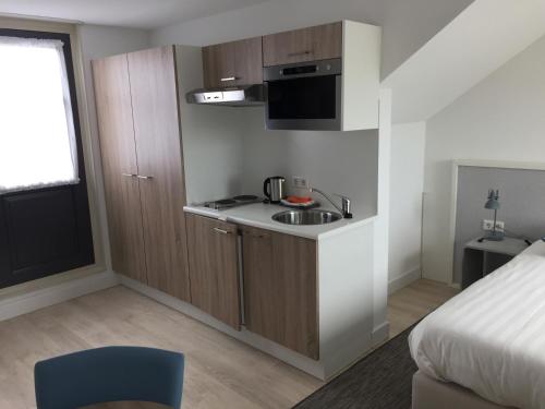Kuchyň nebo kuchyňský kout v ubytování Hotel Bosch En Zee