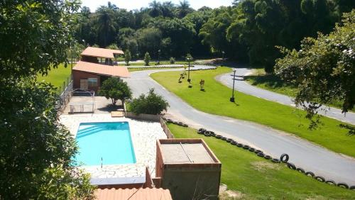 an aerial view of a house with a swimming pool at Pousada Kart Clube in São João del Rei