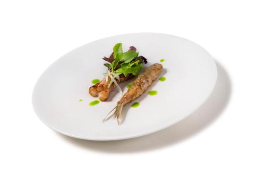 a plate of food with a carrot on it at Regina Adelaide Hotel & SPA in Garda