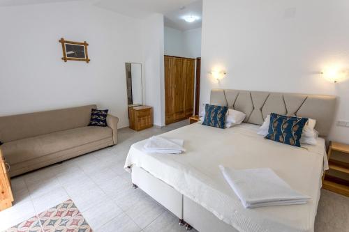 Ένα ή περισσότερα κρεβάτια σε δωμάτιο στο Dalyan Garden Pension