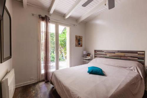 Un pat sau paturi într-o cameră la Villa Trou Aux Biches