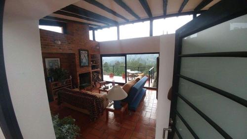 a living room with a view of a living room at Farallones de Sutatausa El Rincón in Sutatausa