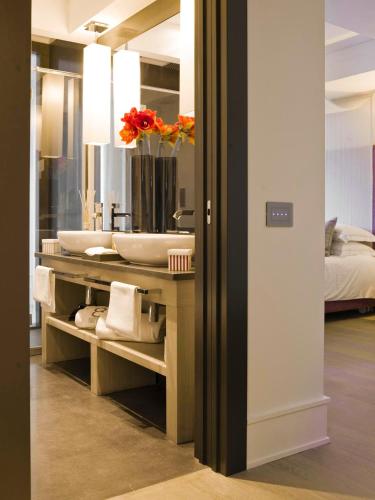 a bathroom with a sink and a mirror at Eight Hotel Paraggi in Santa Margherita Ligure