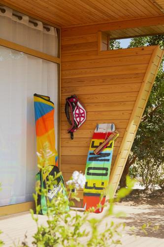 a pair of surfboards sitting on the side of a house at Hotel Dakhla Club & SPA in Dakhla