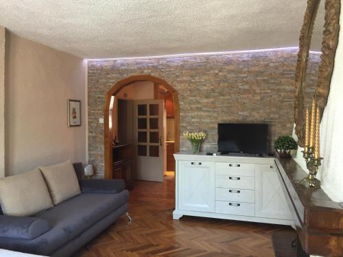a living room with a couch and a tv at Apartments Lara in Kotor