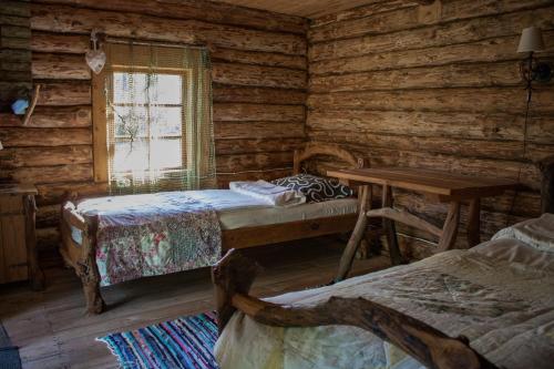 Postel nebo postele na pokoji v ubytování Kuusetuka Tourism Farm