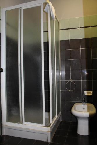 a bathroom with a shower and a toilet at Da Mariuccia in Robecchetto con Induno
