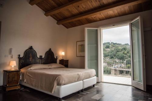 Säng eller sängar i ett rum på Hotel Dell'Orologio