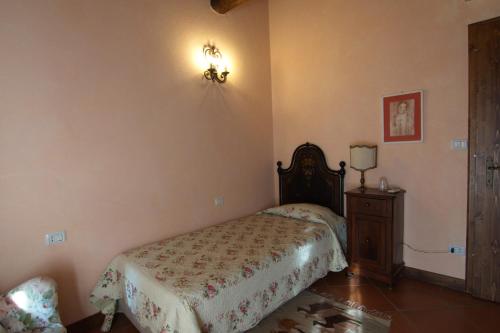 a bedroom with a bed and a dresser in it at Agriturismo La Cascinetta in Pieve di Cento
