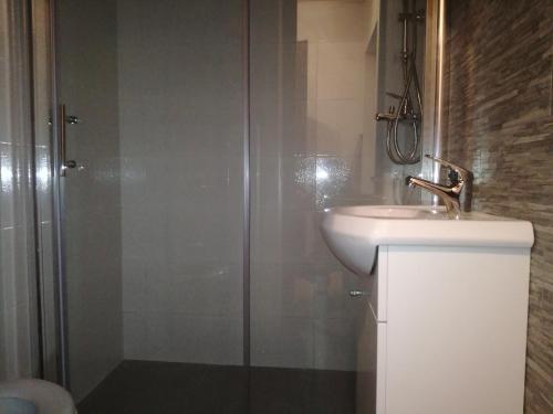 a bathroom with a sink and a shower at Apartment Ivan in Marina