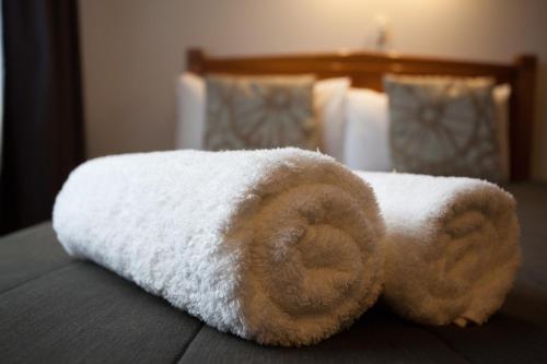 a stuffed animal sitting on top of a bed at Alton Lodge Motel in Whakatane