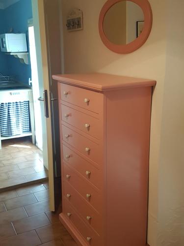 a dresser in a room with a mirror at Accasamia Terricciola in Terricciola